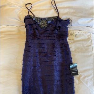 Navy blue cocktail dress with bugle bead details